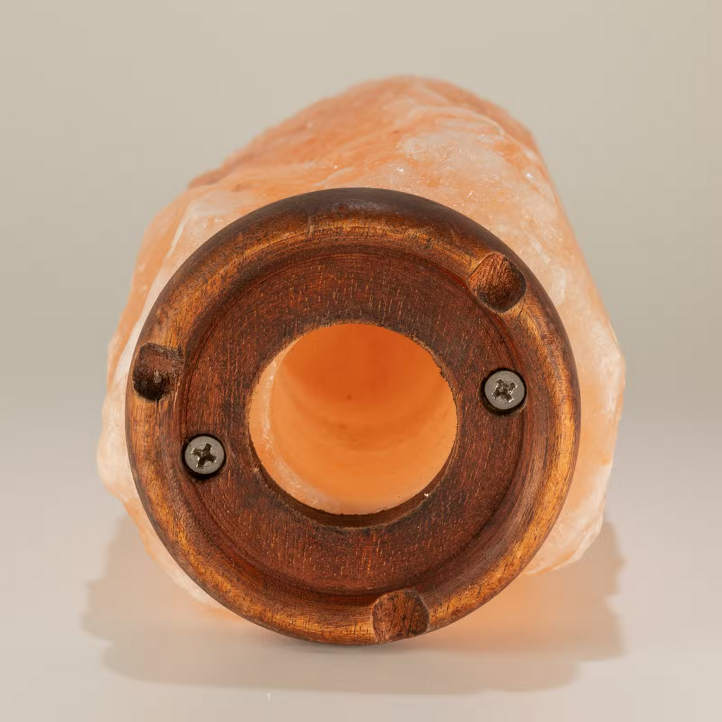 Himalayan salt lamp from Cometto, 1.5-2 kg, glowing with warm orange light, designed for home decor and ambient illumination.