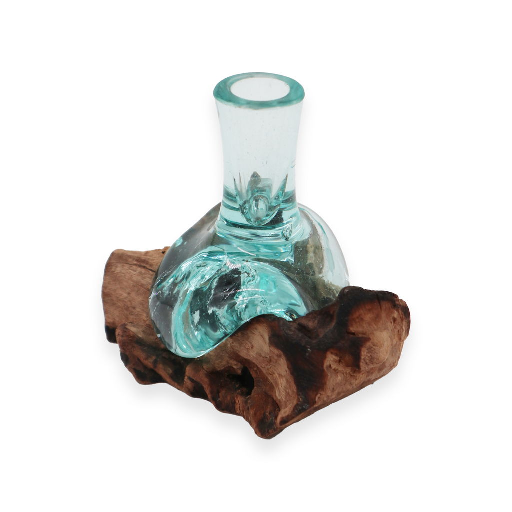 Small decorative glass vase from Ancient Wisdom with melted glass design on natural wood base, showcasing artistic craftsmanship.